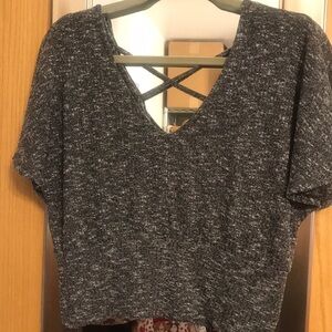 Almost Famous size XL crop top with criss cross in back.  Black and white